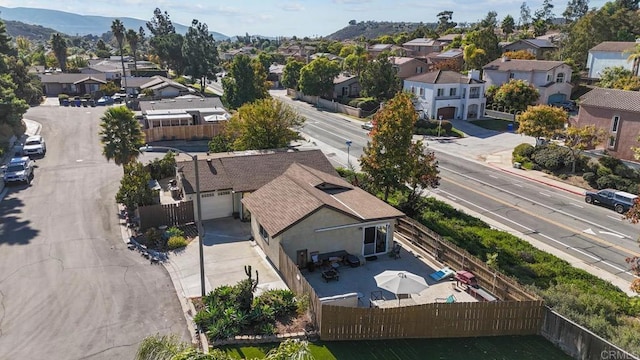 birds eye view of property with a mountain view