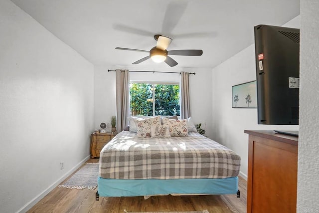 bedroom featuring ceiling fan and hardwood / wood-style floors