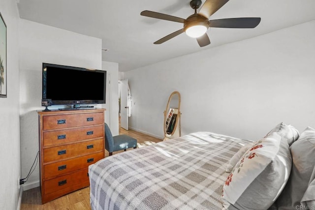 bedroom featuring light hardwood / wood-style floors and ceiling fan