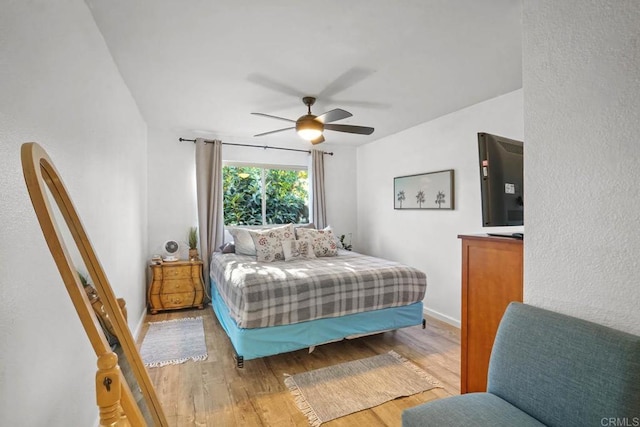 bedroom featuring ceiling fan and light wood-type flooring