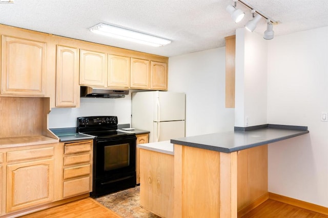 kitchen featuring white fridge, kitchen peninsula, light hardwood / wood-style flooring, and black / electric stove