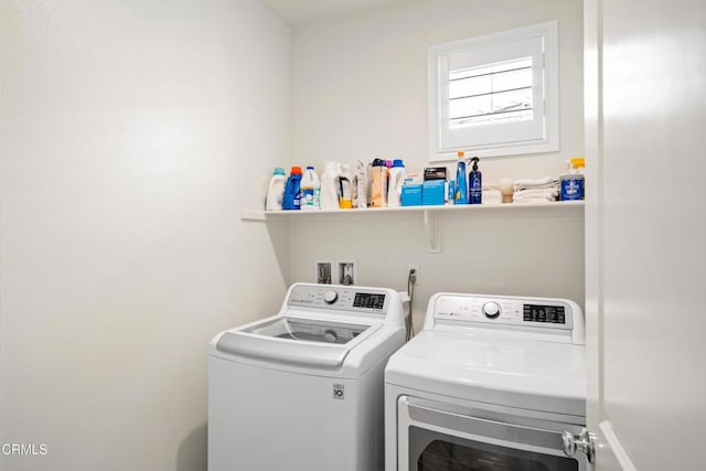 laundry room with washing machine and dryer