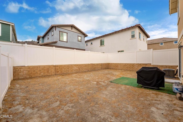 view of yard with a patio and central AC