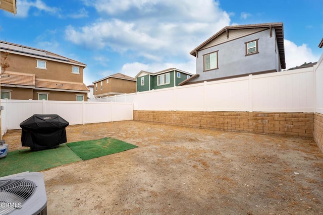 view of yard featuring a patio area and central air condition unit