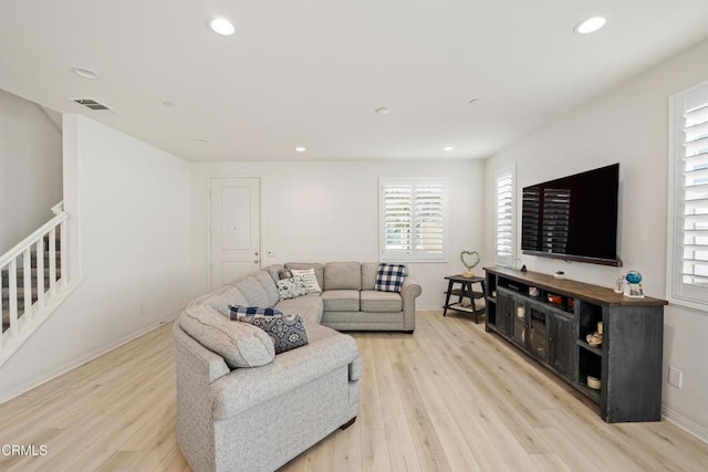 living room with light hardwood / wood-style flooring