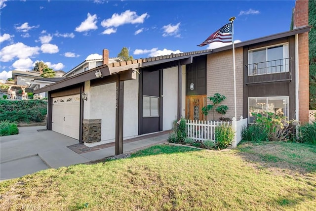 view of front of property featuring a garage and a front yard