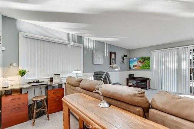 living room featuring light carpet