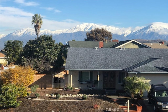 view of front of property featuring a mountain view and covered porch