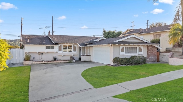 ranch-style home with a garage and a front lawn