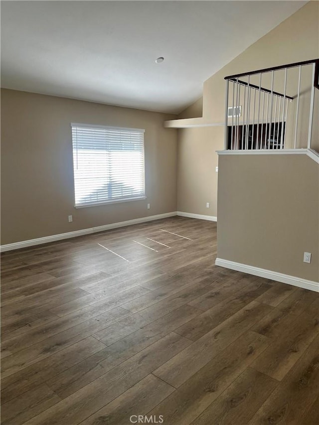 empty room with dark wood-type flooring