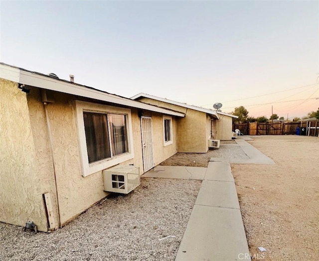 view of property exterior at dusk