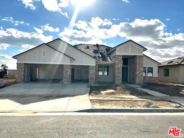 view of front of home with a carport