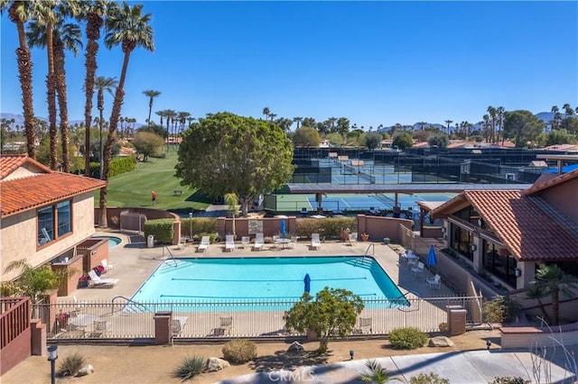 view of swimming pool featuring a patio area