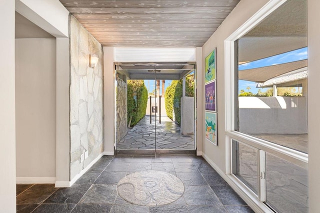 doorway to outside featuring wooden ceiling