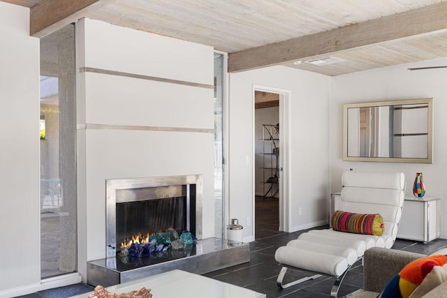 tiled living room featuring beamed ceiling and wood ceiling