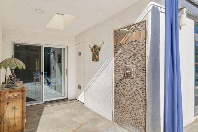 bathroom featuring a skylight