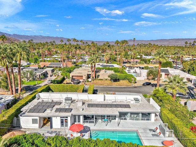 birds eye view of property with a mountain view