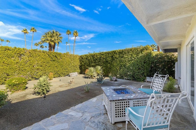 view of patio featuring an outdoor fire pit