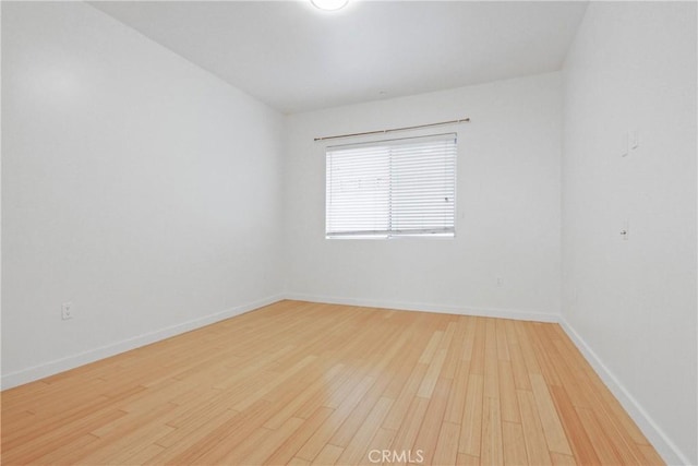 empty room featuring hardwood / wood-style flooring