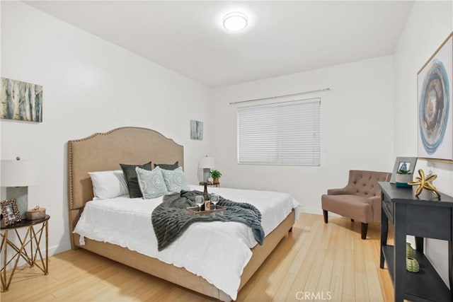 bedroom featuring wood-type flooring