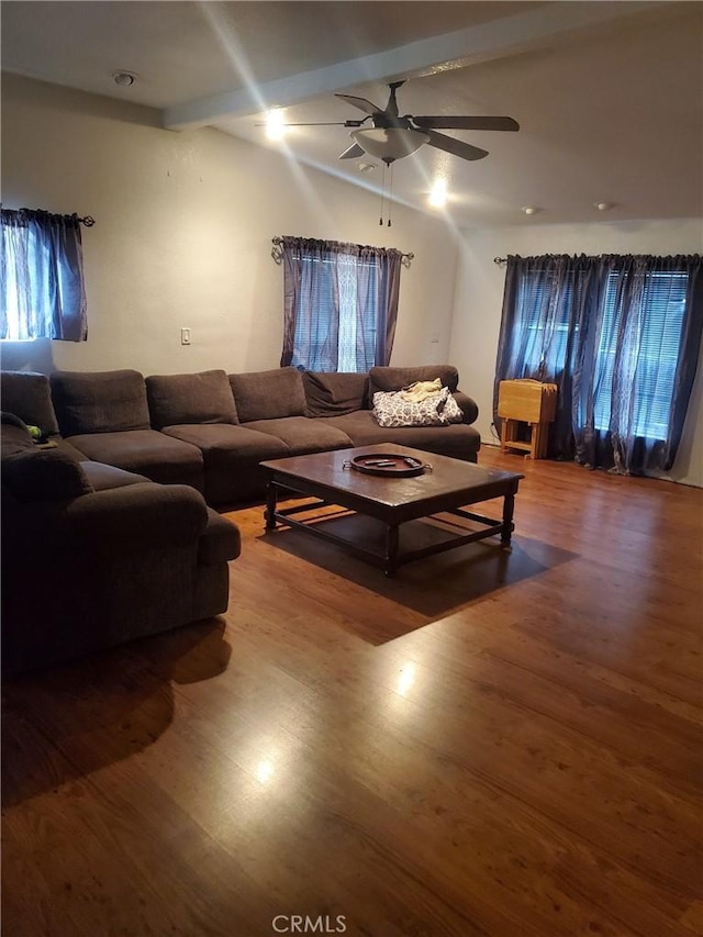 living room with beam ceiling, ceiling fan, and hardwood / wood-style floors