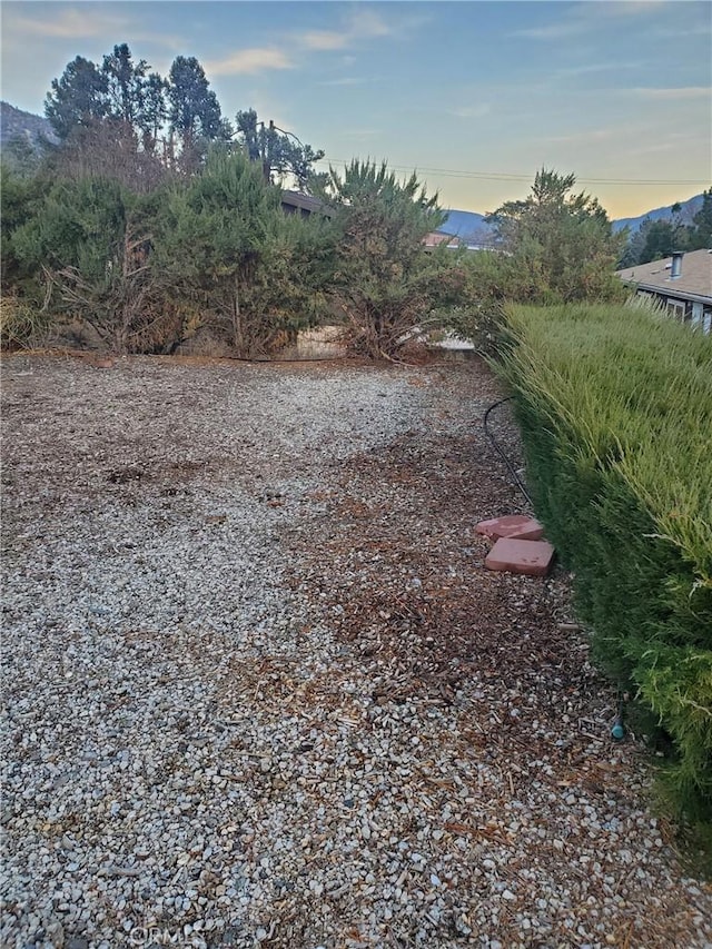 yard at dusk with a mountain view