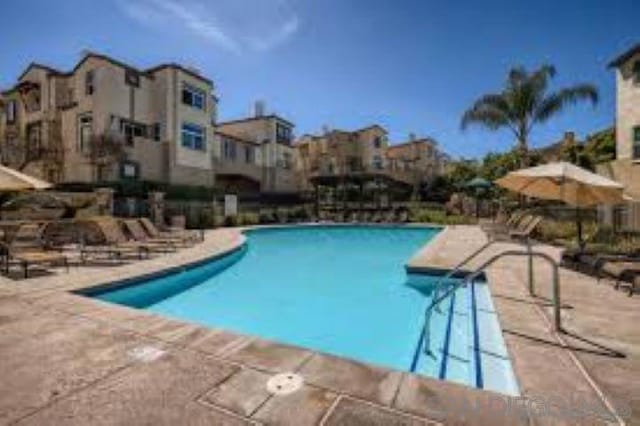 view of swimming pool featuring a patio area