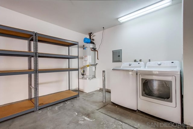 laundry area with independent washer and dryer, strapped water heater, and electric panel