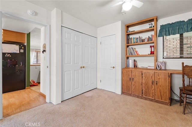 interior space featuring ceiling fan