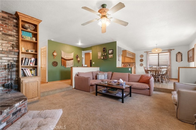 living room with light carpet, a textured ceiling, and ceiling fan