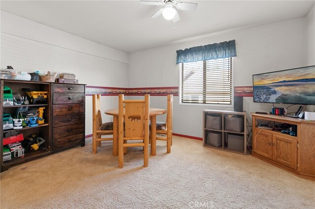 bedroom featuring light colored carpet and ceiling fan