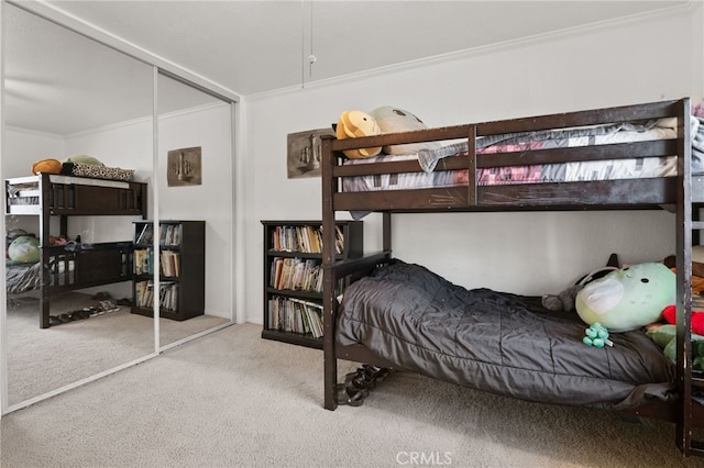 bedroom featuring light colored carpet, a closet, and crown molding