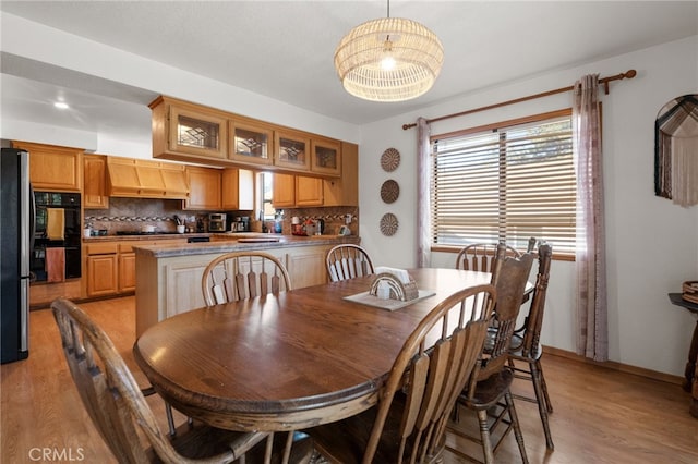 dining space featuring light hardwood / wood-style floors