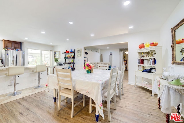 dining area with light hardwood / wood-style flooring