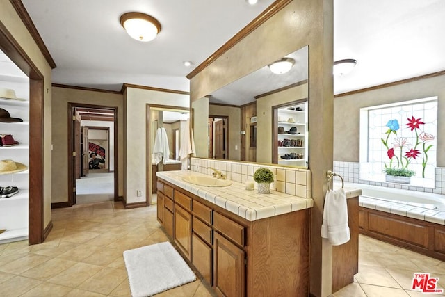 bathroom featuring vanity, backsplash, and tile patterned floors