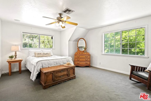 bedroom with ceiling fan, carpet floors, and vaulted ceiling