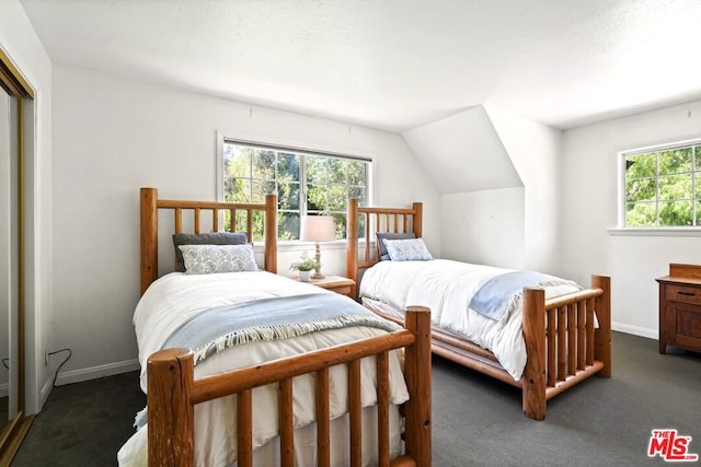 carpeted bedroom featuring vaulted ceiling