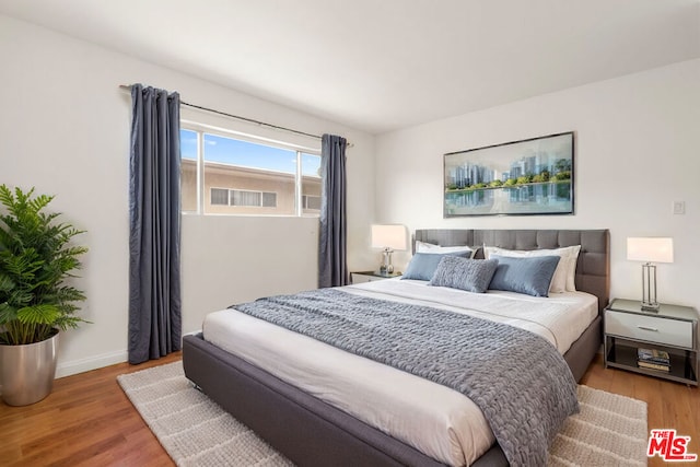 bedroom featuring wood-type flooring