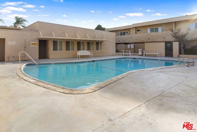 view of pool with a patio