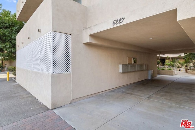 view of side of home featuring a carport