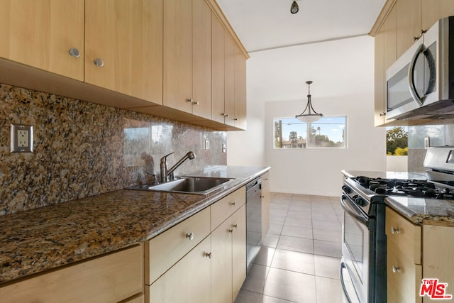 kitchen with sink, light brown cabinets, tasteful backsplash, light tile patterned floors, and appliances with stainless steel finishes