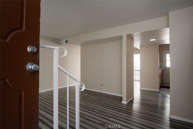 foyer entrance with dark hardwood / wood-style floors