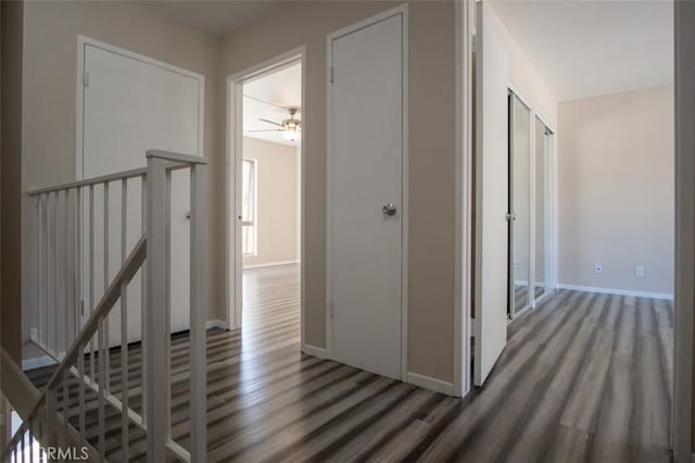 corridor featuring dark wood-type flooring