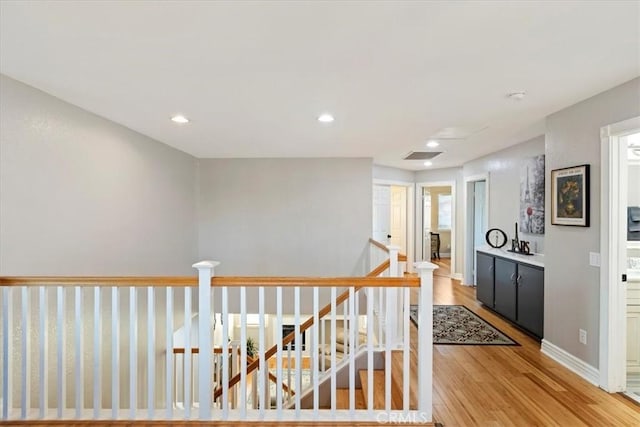 hall with light hardwood / wood-style flooring