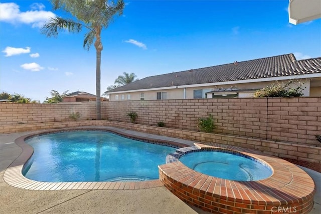 view of pool with an in ground hot tub