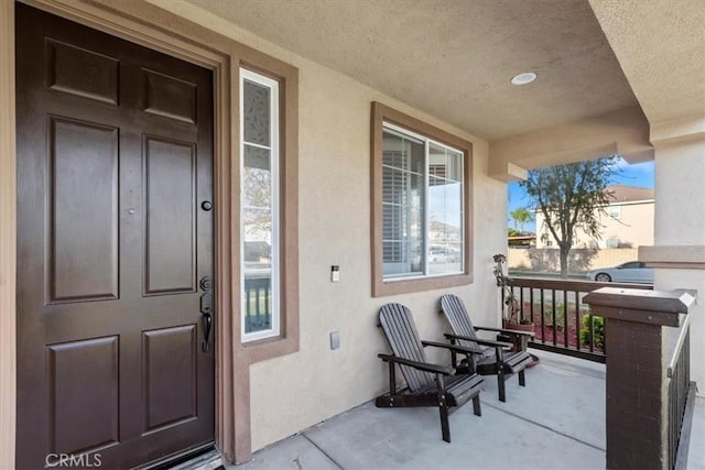 entrance to property featuring a porch