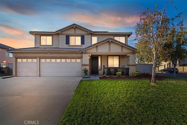 craftsman house with a lawn, a porch, and a garage