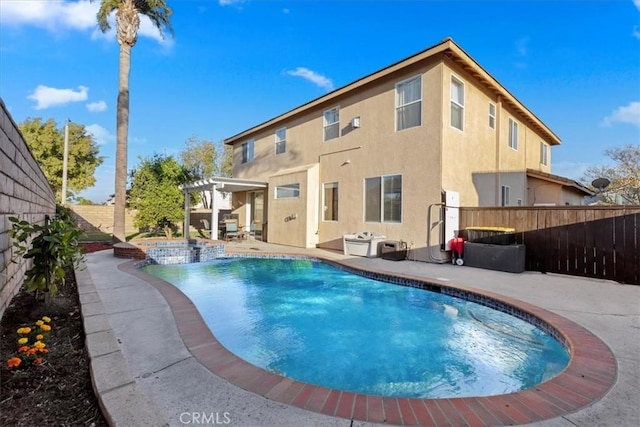 view of swimming pool featuring a patio area, a pergola, and an in ground hot tub