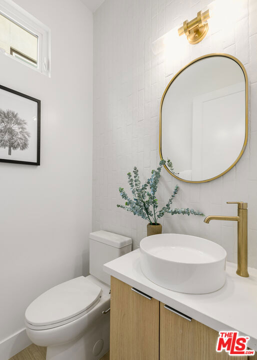 bathroom with vanity and toilet