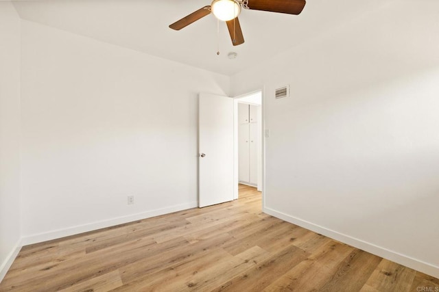 unfurnished room featuring ceiling fan and light hardwood / wood-style flooring